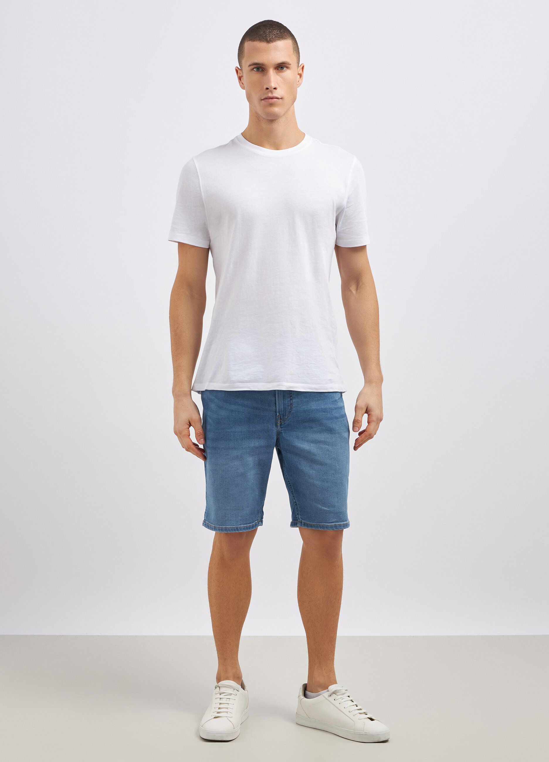 Shorts in denim di misto cotone stretch uomo_0